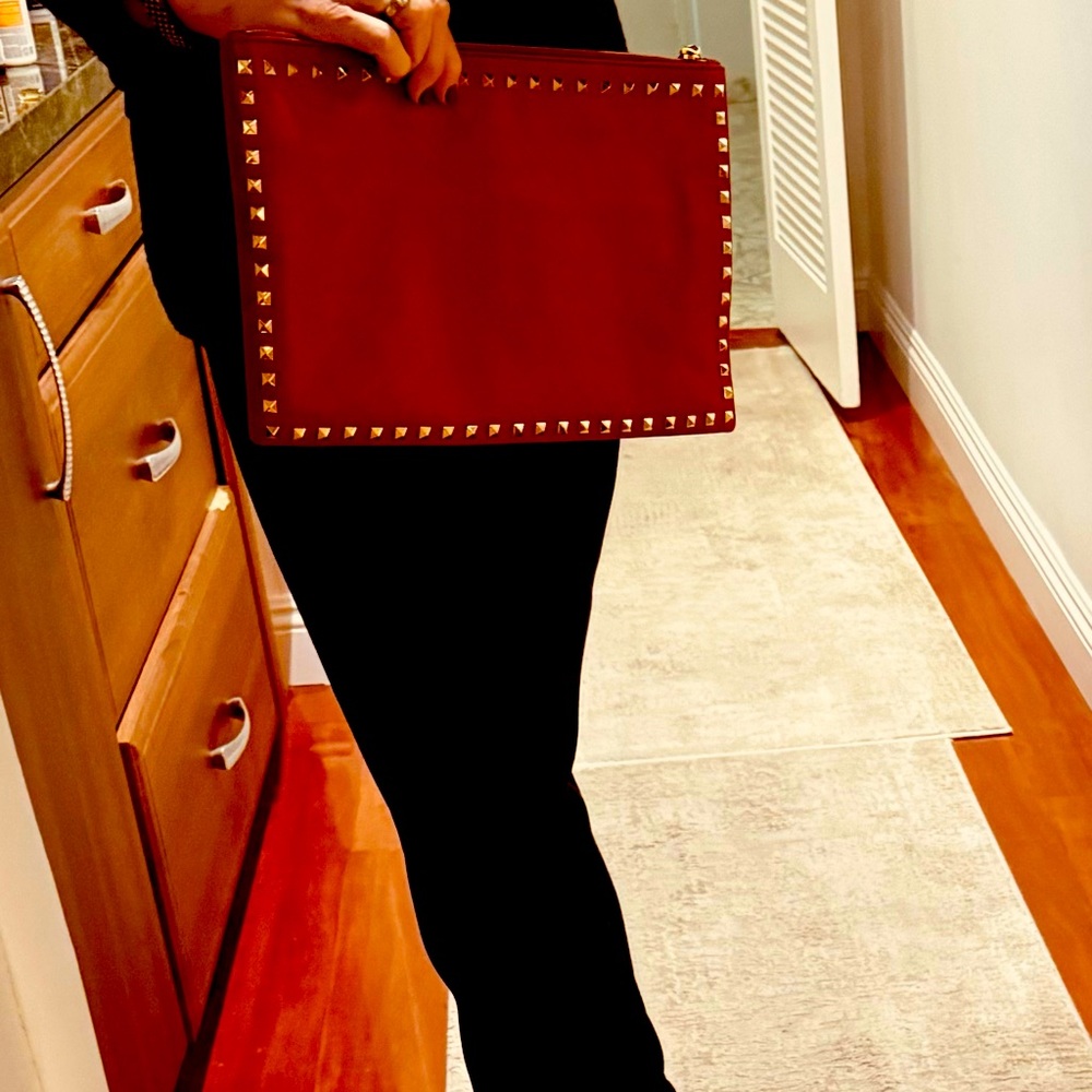 Valentino red leather clutch. Rockstud collection!
12 x9”, smooth leather.